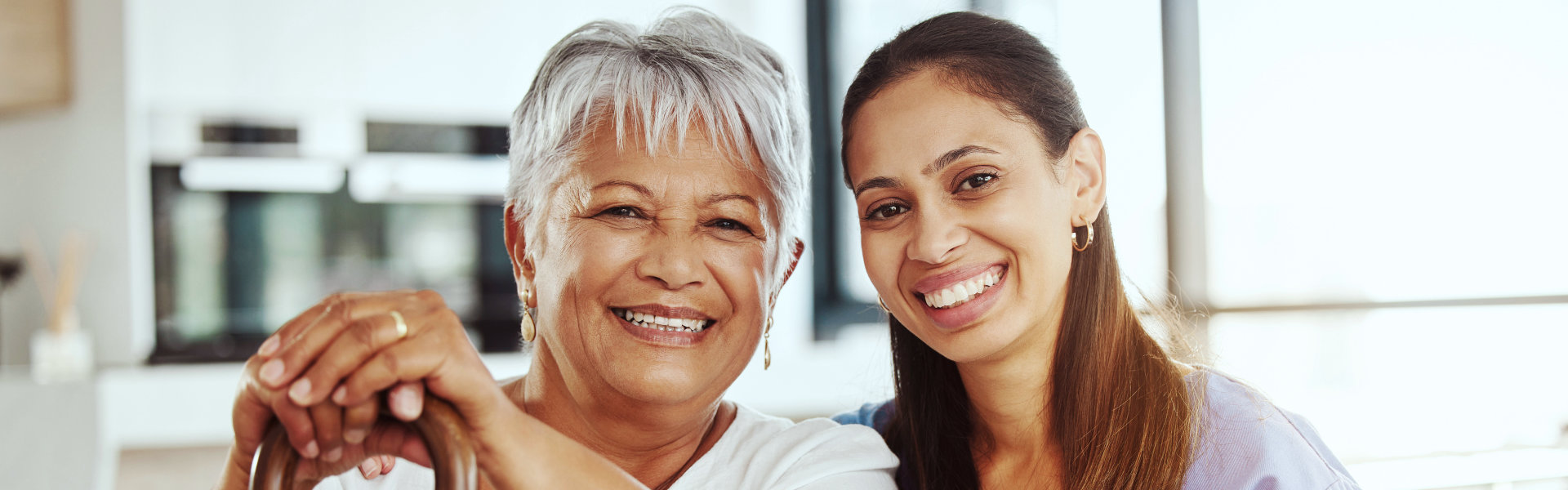 woman holding the shoulder of senior 