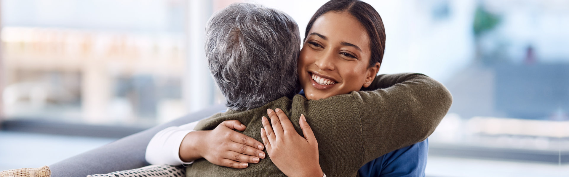 woman hugging senior