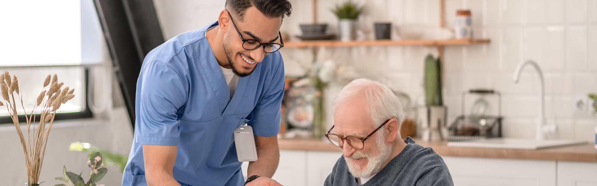 man standing and senior sitting