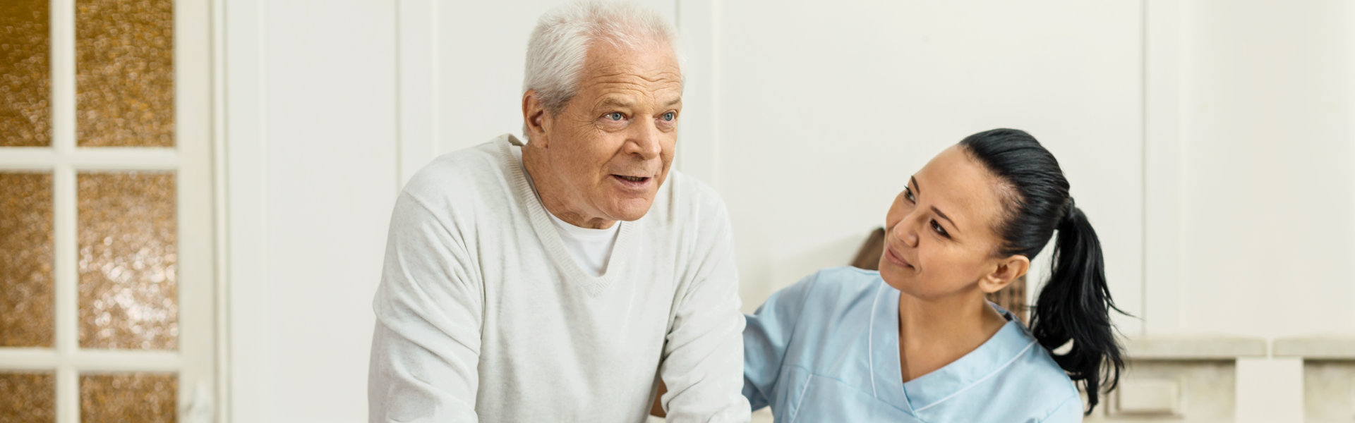 woman helping senior