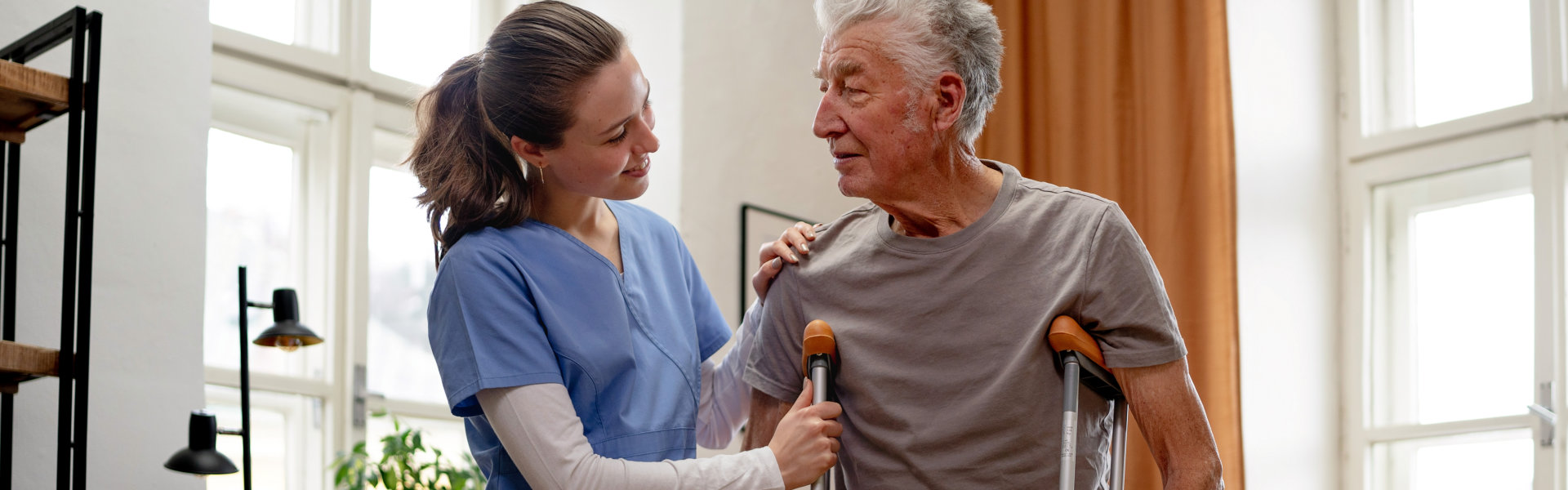 woman helping senior